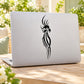 Tribal peacock head decal, black feather design on a light laptop lid