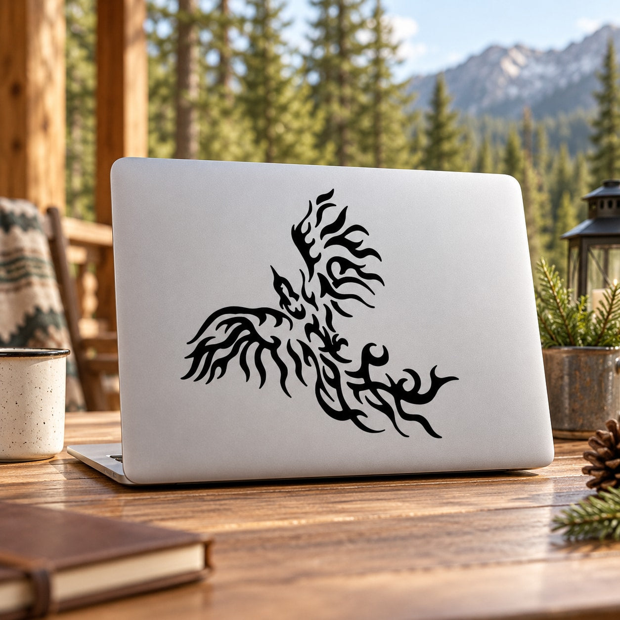 Black flame eagle decal graphic on a laptop lid