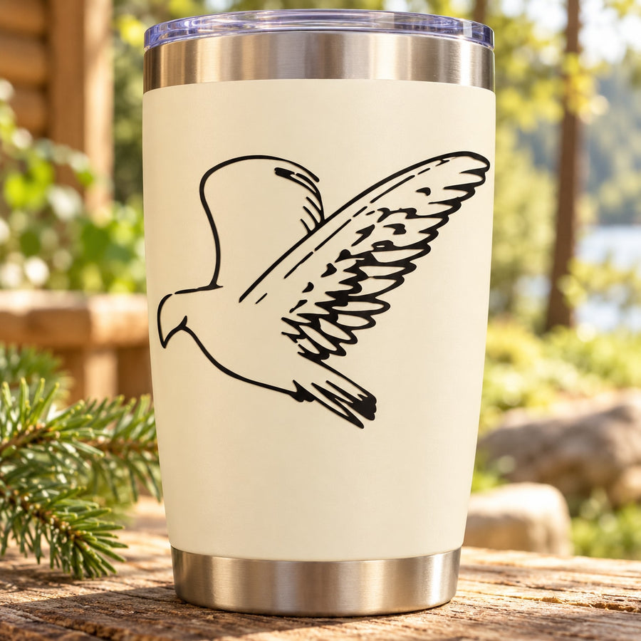 Swooping falcon decal on cream tumbler, black bird with spread wings