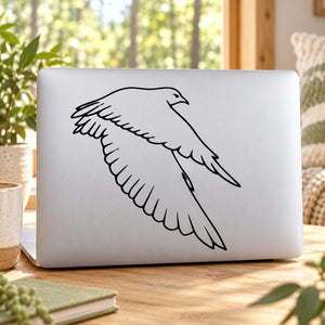 Black flying falcon wing line-art decal on a white surface