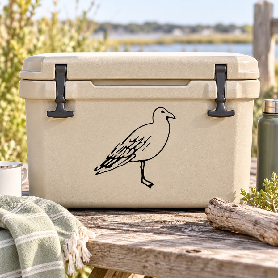 Beige cooler lid with standing shore bird decal in black ink