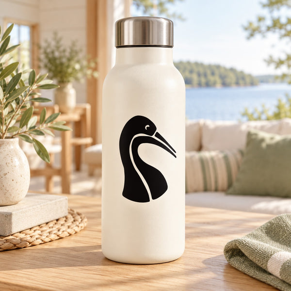 Water bird head decal with black bird silhouette on white bottle