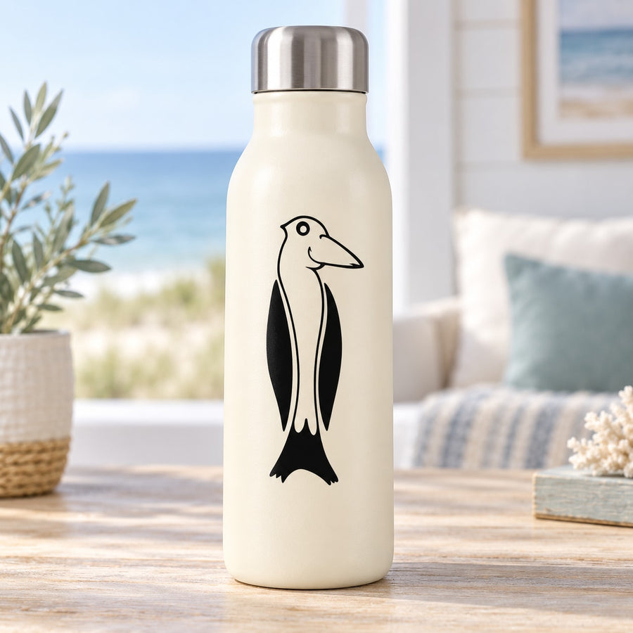Smiling penguin face decal with black-and-white bird illustration on a bottle