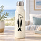 Smiling penguin face decal with black-and-white bird illustration on a bottle