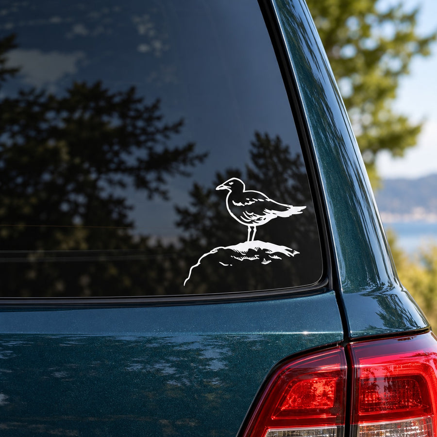 Shore bird perched on rock decal, black and white graphic on car window glass