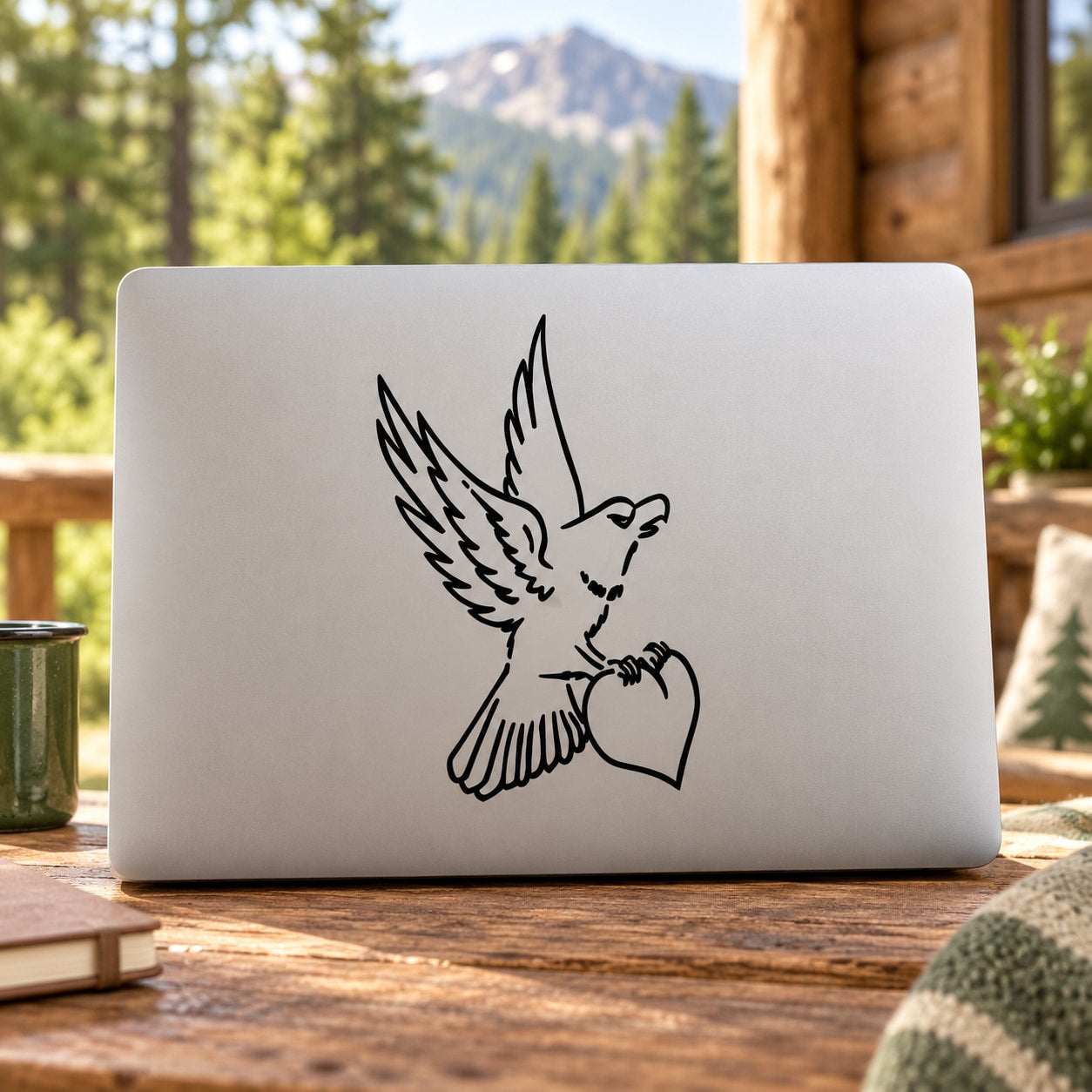 Heart-holding hawk decal sticker with black outline design on light background