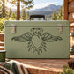 Double-headed eagle and heart decal, black line art on green surface