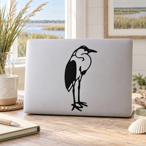 White laptop with black egret silhouette decal