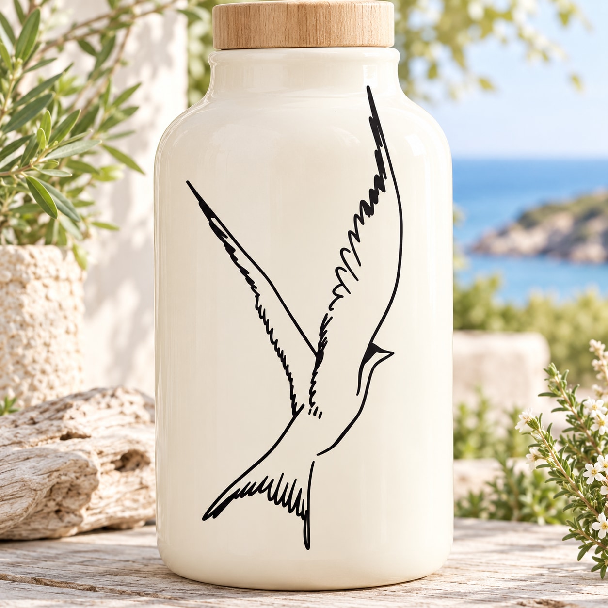 Black flapping swallow decal on front of clear glass bottle with wooden lid