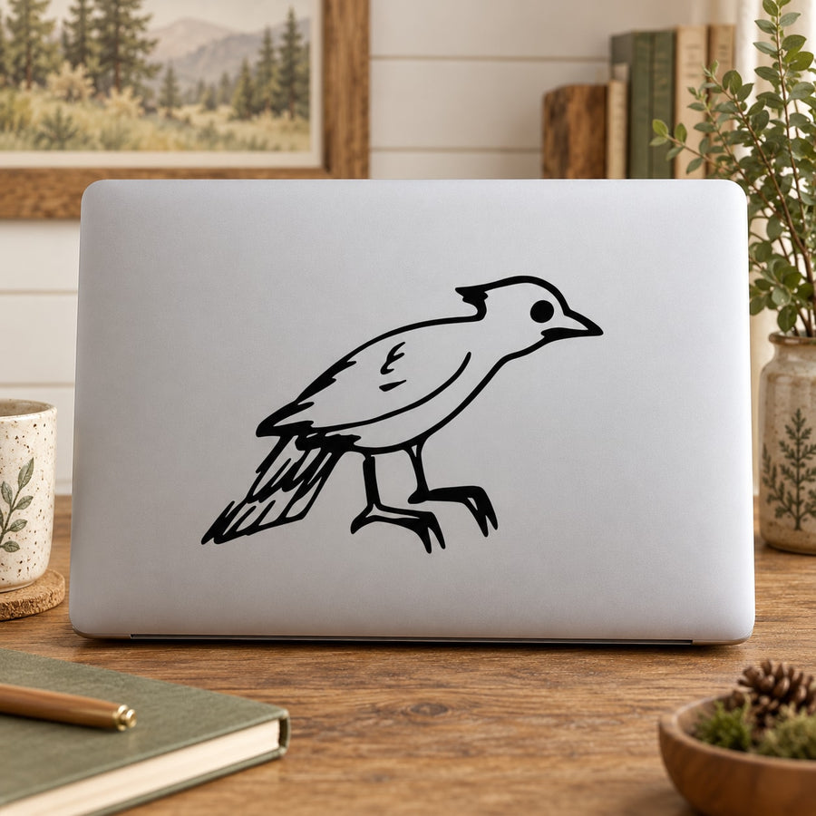 Baby woodpecker decal: black bird outline on light gray laptop lid