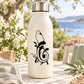 White bottle with bird on swirling floral decal