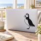 Standing puffin decal with black-and-white silhouette, simple outline style