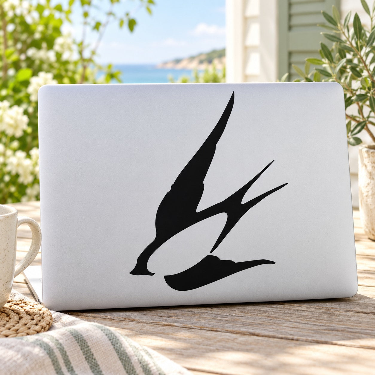 Diving swallow decal with black flying-bird silhouette on white