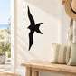 Flying shore bird silhouette decal in black on white panel