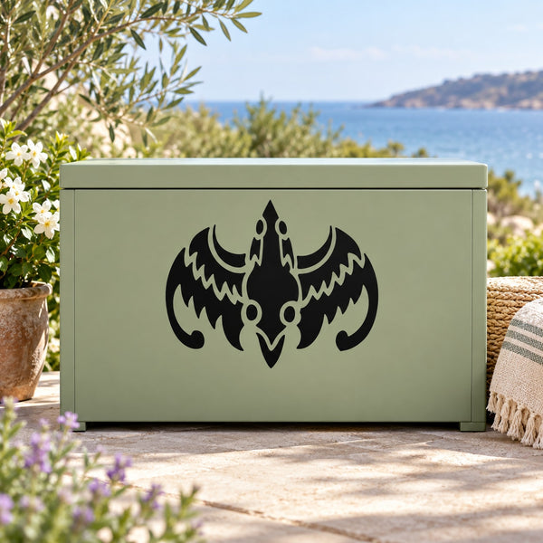 Abstract tribal dragon decal, black symmetrical winged emblem on a surface
