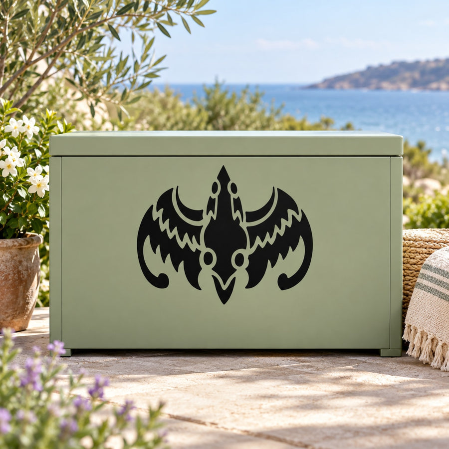 Abstract tribal dragon decal, black symmetrical winged emblem on a surface