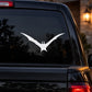 White flying bat decal on car window