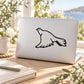 Flying dove decal sticker with black outline, applied to light laptop lid
