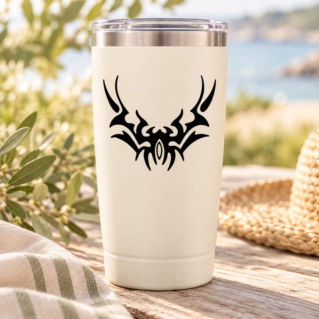 Tribal abstract dove decal in black on a light tumbler