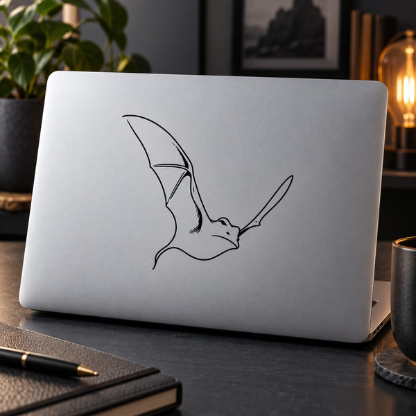 Bat line-art decal on light gray laptop lid