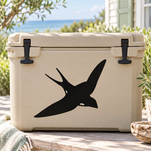 Swallow decal showing a black swooping bird on a light beige cooler lid