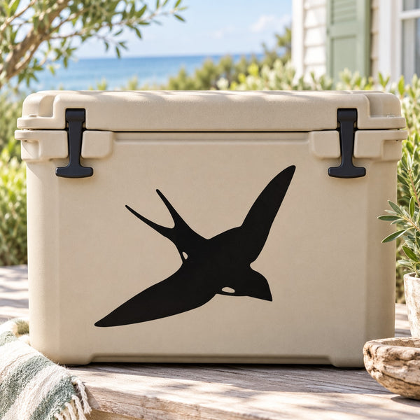 Swallow decal showing a black swooping bird on a light beige cooler lid