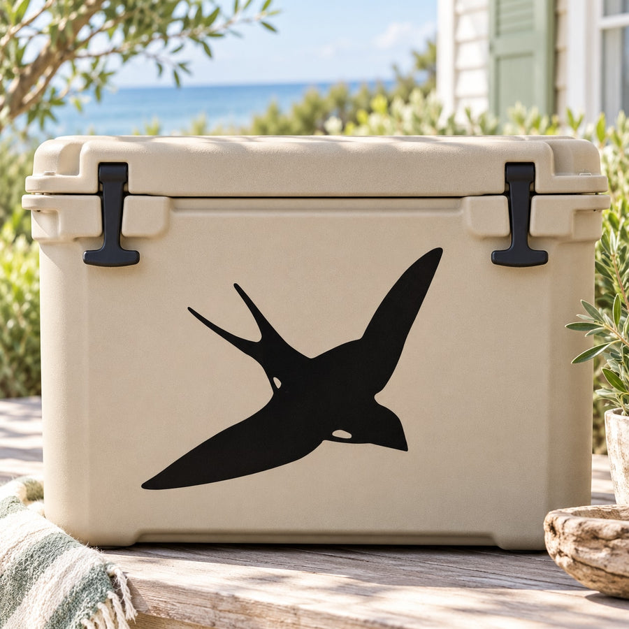 Swallow decal showing a black swooping bird on a light beige cooler lid