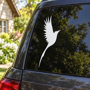 White flying bird decal on car window