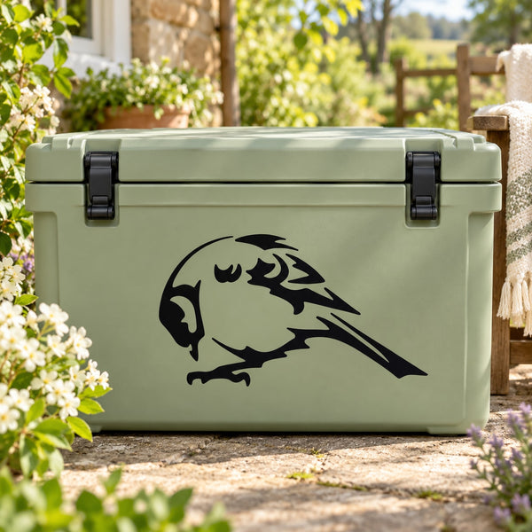 Black finch bird decal with grooming posture on light green surface