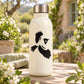Black flying magpie bird decal on a white bottle