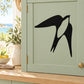 Black flapping swallow wall decal in a bold silhouette