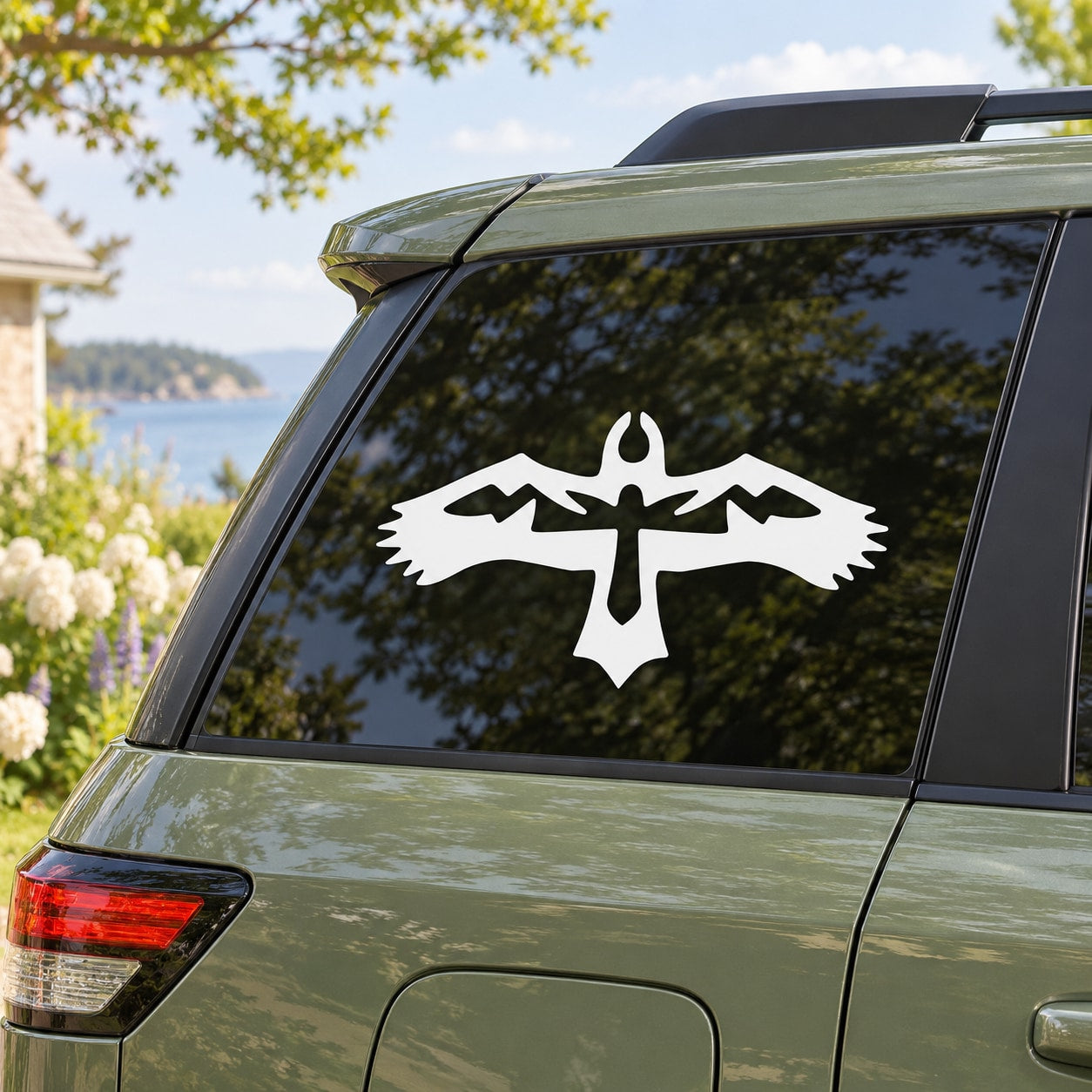 White native bird decal on car rear window