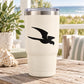 Flying shore bird decal in black on a cream tumbler