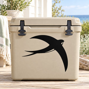 Black swallow silhouette decal on a light-colored cooler