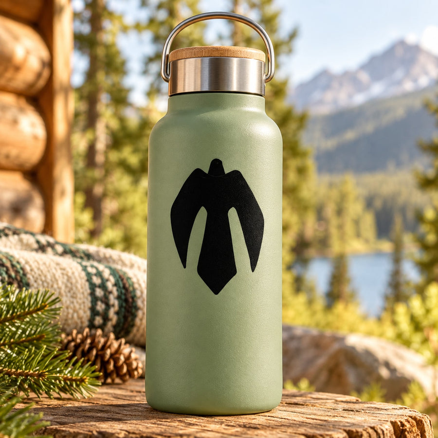 Black hawk decal icon on a green metal water bottle