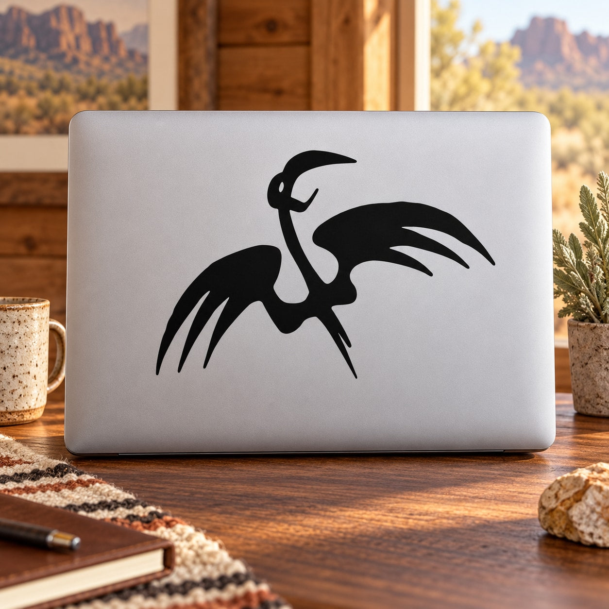 Abstract vulture decal with black silhouette on a light surface