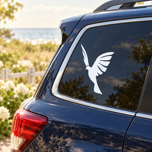 White dove silhouette decal on rear car window