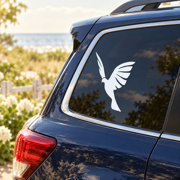 White dove silhouette decal on rear car window
