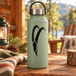 Mint green insulated water bottle with black bird silhouette
