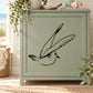 Flying shore bird decal, black line art on light background