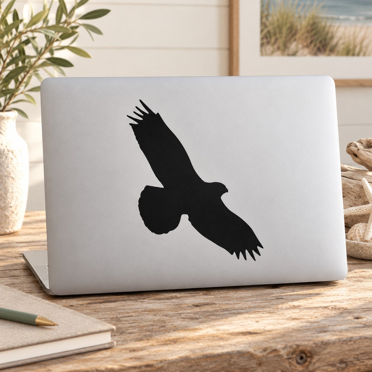 Black hawk silhouette decal for laptop or window, bold wings and sharp beak