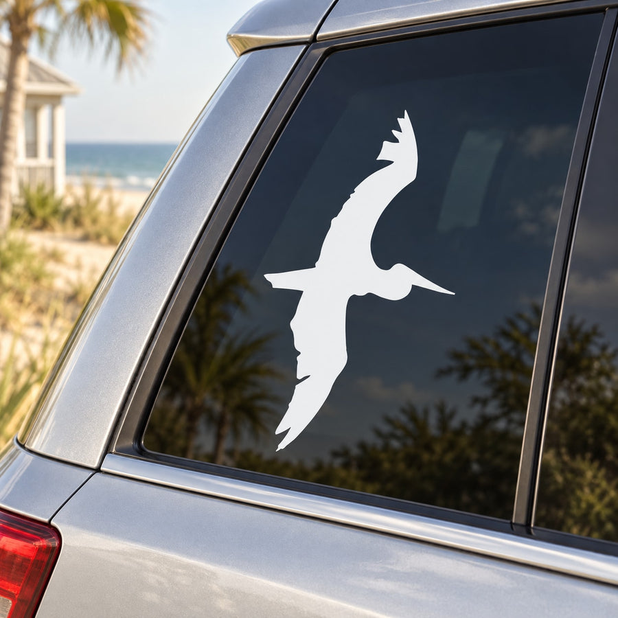 Pelican vinyl decal silhouette on dark car window glass