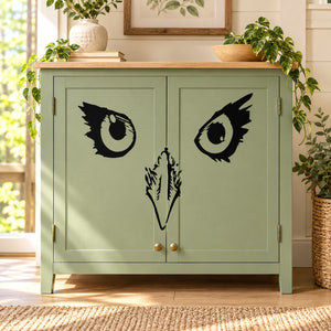Black falcon face wall decal with stylized eyes and beak details