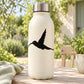 Hummingbird decal with black flying bird silhouette on a light surface