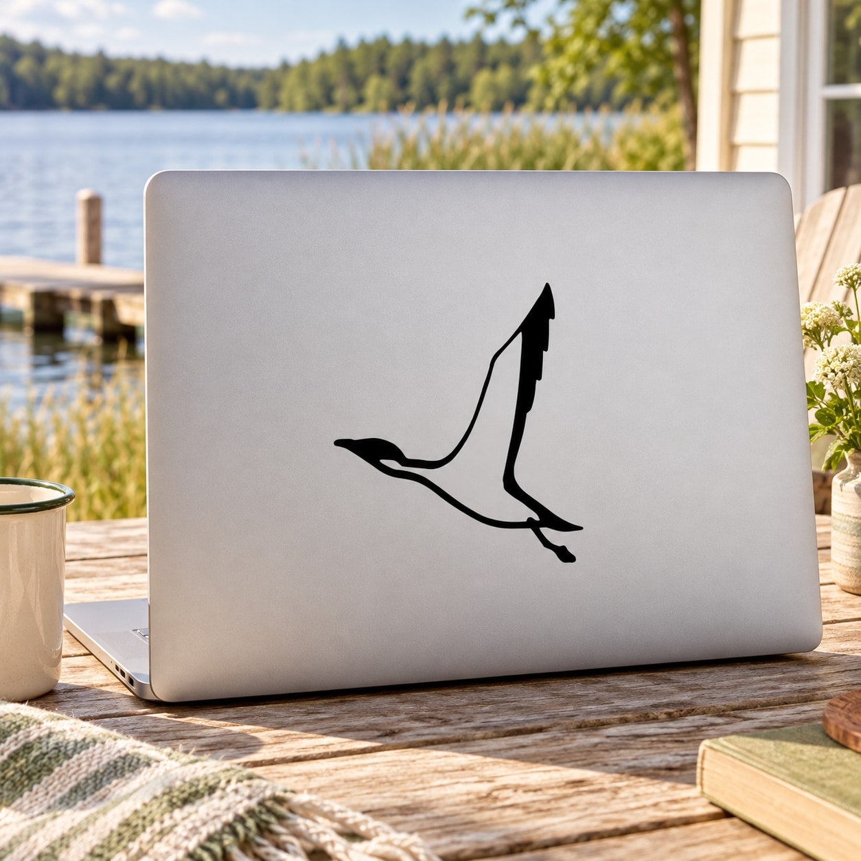 Duck vinyl decal, black standing silhouette with wings outspread.