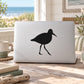 Shore bird decal with black bird silhouette on a light rectangular surface