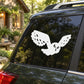 White owl decal with wings spread on car rear window