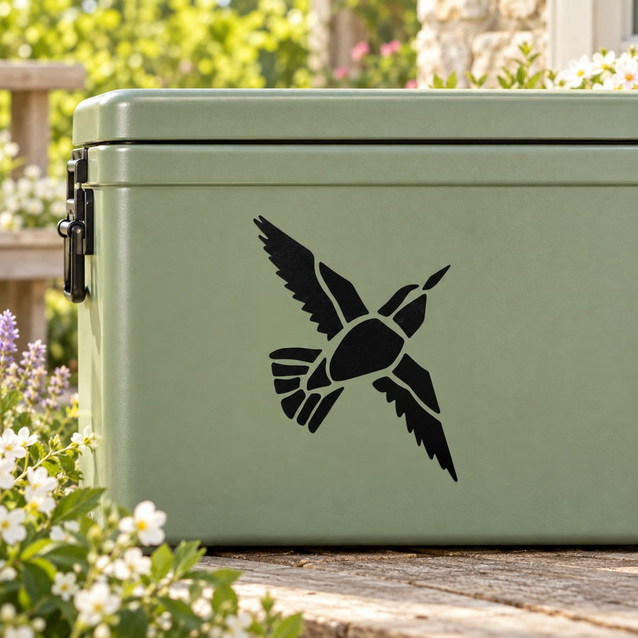 Black bird in flight vinyl decal on light green mailbox panel