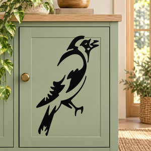 Black falcon bird decal with raised beak silhouette on light backing