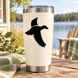 Duck vinyl decal featuring black flying duck silhouette on light surface